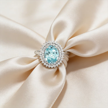 Elegant aquamarine and diamond halo ring