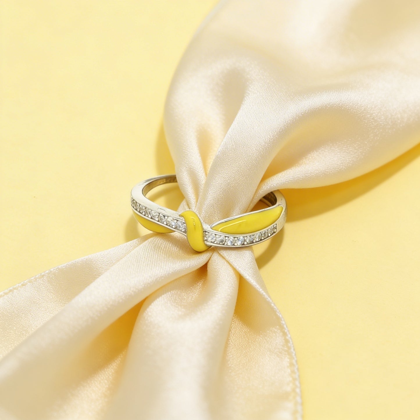 Silver ring with yellow enamel and stones