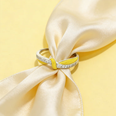 Silver ring with yellow enamel and stones