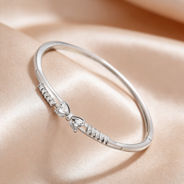 Elegant silver bangle with diamond hearts