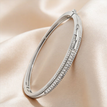 Elegant diamond bangle with crossover design