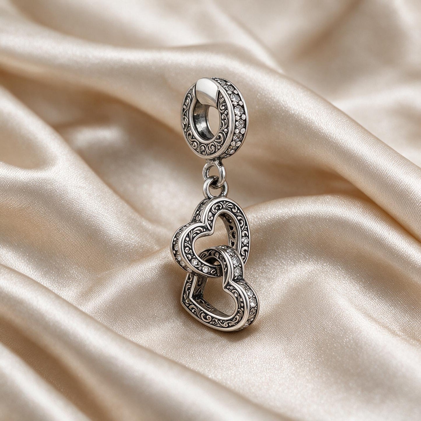 Interlocking Hearts Charm