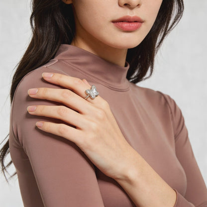Delicate butterfly ring on fabric