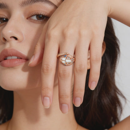 Rose silver snake ring with sapphire eyes